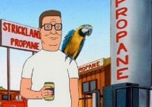 Hank Hill in propane yard with macaw parrot parrot on his shoulder