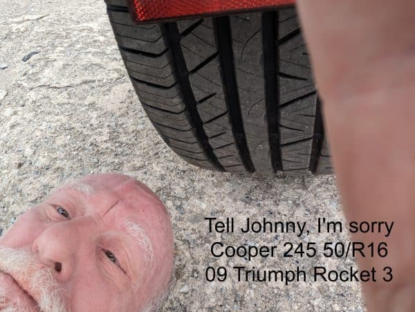 Cooper car tire on rear of Triumph Rockt 3 with Mitch Rezman taking a selfie